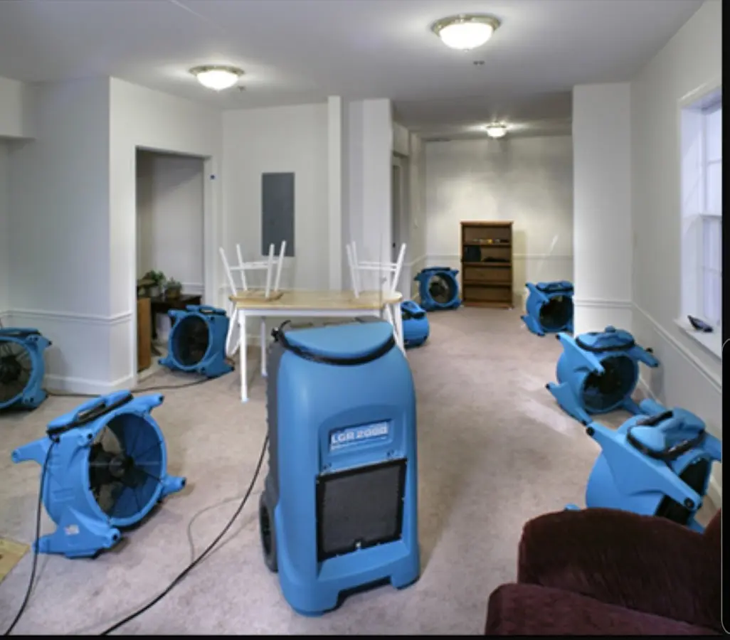 Air movers and dehumidifier setup for Water Damage Restoration in King City